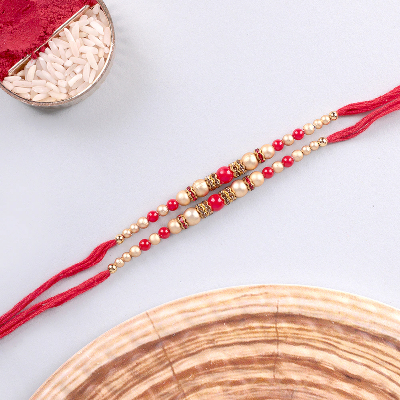 Set Of 2 White Red Pearl Rakhi